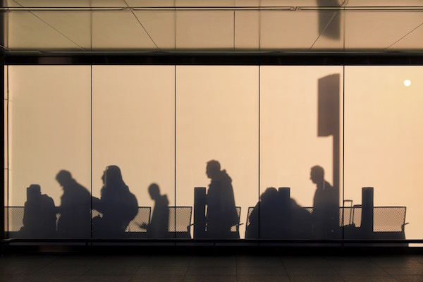 passengers wait in an airport