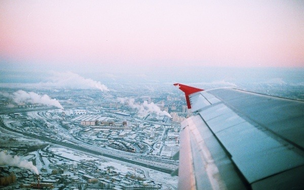 Airplane over a snowy town