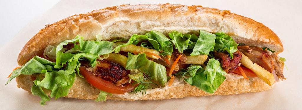Packed beef sandwich with lettuce and tomatoes