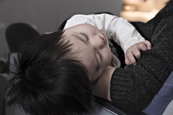 toddler sleeping in plane