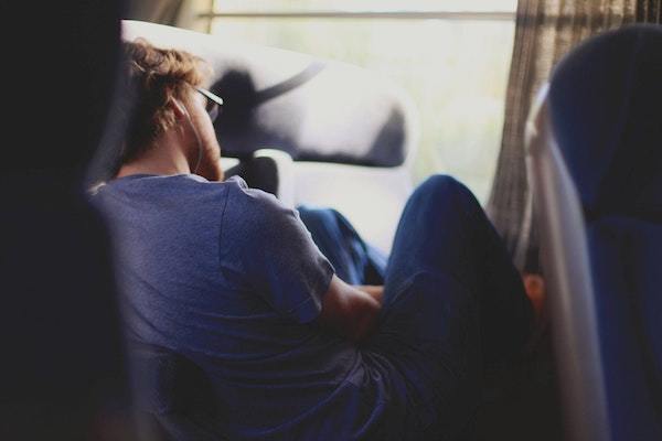 person sleeping on seats