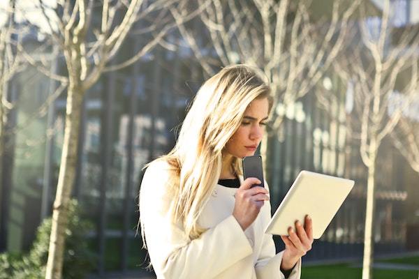 woman looking at mobile devices