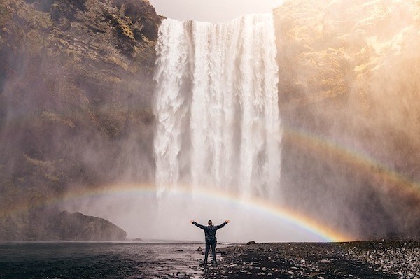 solo traveller on waterfall