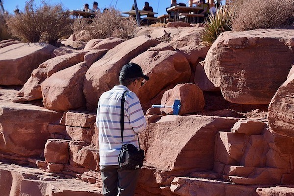 Selfie by red rocks with selfie stick